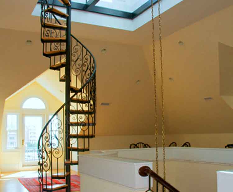 Metal spiral staircase in a home built in Norfolk Virginia by Covington Contracting