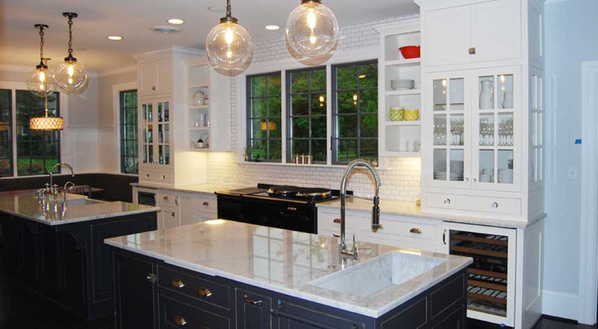 A kitchen remodel with black cabinets and a double island in Virginia Beach