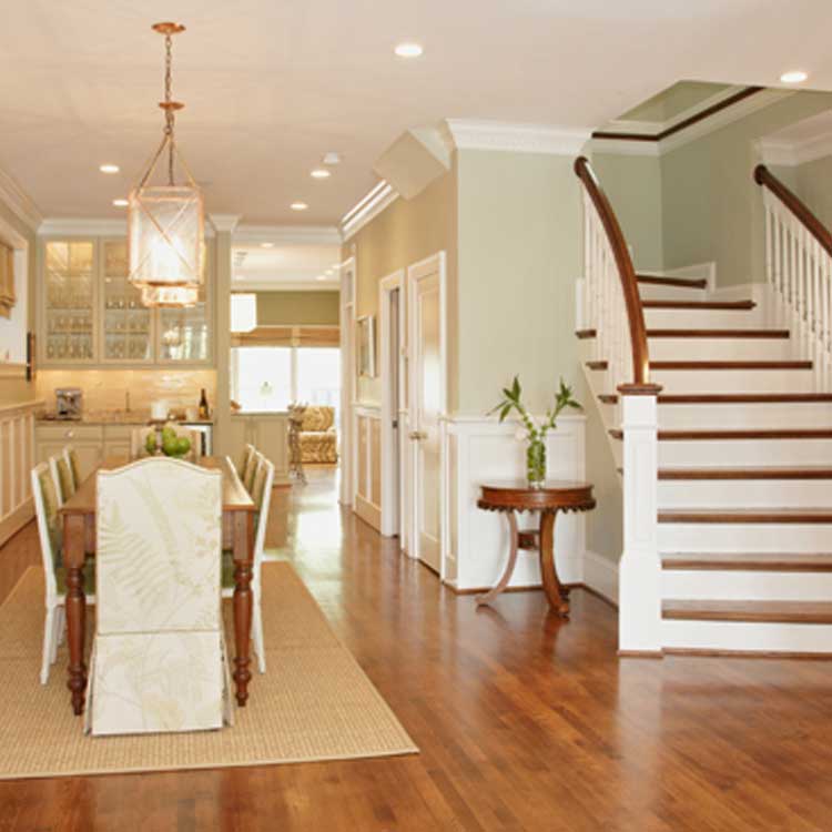 A stunning dining room featuring a grand staircase